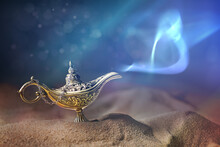 Magical Aladdin Oil Lamp With Genie In Desert At Night.