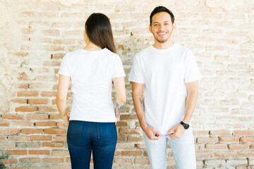 Wall Mural - Attractive couple made custom t-shirts