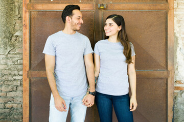 Wall Mural - Happy boyfriend and girlfriend in casual t-shirts