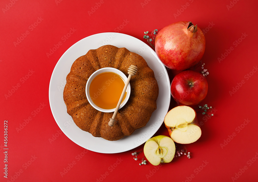 Bread with honey, pomegranate and apples on color background. Rosh hashanah (Jewish New Year) celebration