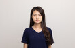 © Chanakon - Beautiful young asian woman standing on isolated white background. Thai Teenage girl around 20 looking at camera.