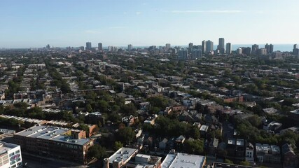 Wall Mural - Aerial above city residential district with houses and Lake Michigan as background