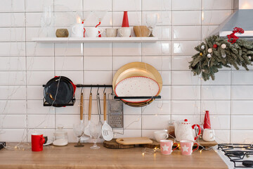 Wall Mural - White festive kitchen - tiles on the wall, white refrigerator, red decor elements. Christmas home design.