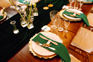 Wall Mural - Beautiful decorated table for the event in the restaurant in emerald color. Wedding, birthday, party, event concept.