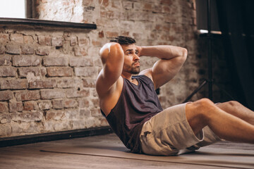 Wall Mural - Fitness man doing abdominal exercises