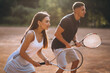 © Petro - Young couple playing tennis at the court