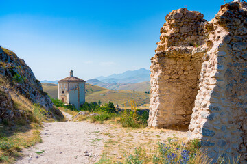 Wall Mural - Santa Maria della Pieta church, near to castle of Rocca Calascio, Aquila, Abruzzo, Italy. Part of Gran Sasso National Park the castle is one of 15 most beautiful in the world