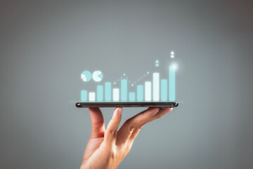 Fototapete - Businessman plan graph growth and increase of chart positive indicators in his business, Smartphone in hand