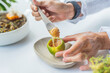 a person tasting a haute cuisine dish based on lemon, foie grass and honey. Gourmet concept and haute cuisine.