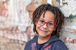 © malija - close up portrait of a cute African American boy with eyeglasses