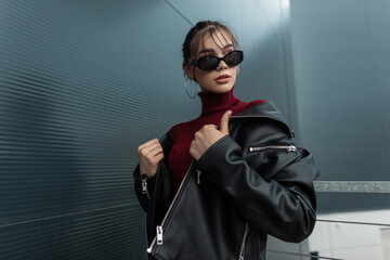 beautiful future fashionable woman model in stylish sunglasses with black denim jacket and burgundy 