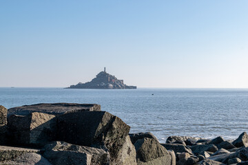 There are islands in the middle of the sea and reefs and beaches on the coast