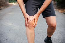A Man Athlete Suffering From Knee Pain Due IT Band Syndrome