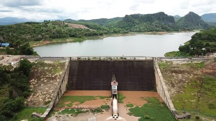 Wall Mural - Aerial view of Mae Suai reservoir (or Dammed valleys) located at a narrow part of a valley downstream of a natural basin in Mae Suai district of Chiang Rai province of Thailand.