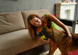 © Вячеслав Чичаев - High resolution photo young brunette playing with ball smiling with belgian shepherd malinois at home