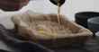 man making granola at home, pour honey