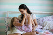 © alexkich - Morning idleness. Mom and daughter have fun.