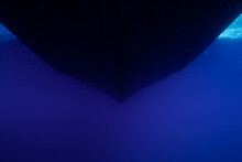 A Shot Of The Hull Of A Boat Taken From Underneath The Water