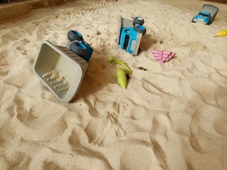 colorful and various plastic tools in the sandpit for children to play all the time design for  education concept