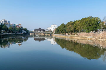 Wall Mural - The city's buildings are reflected in the river