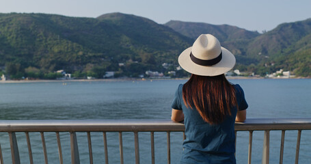 Sticker - Woman enjoy the landscape sea view