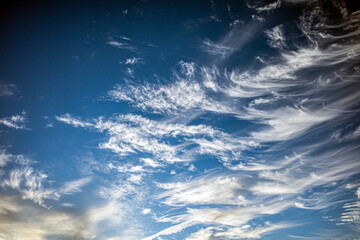 Sticker - Lite and airy wispy clouds against a blue sky, excellent for sky replacement.