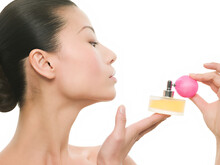 Woman Spraying Perfume