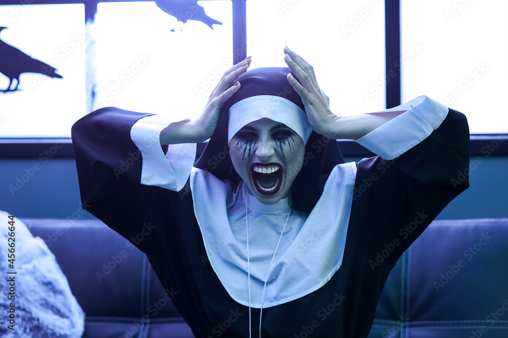 Woman dressed as nun at Halloween party