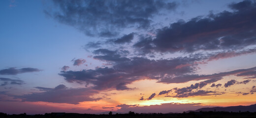 Wall Mural - colorful sunset and sunrise with clouds.blue and orange color of nature.many white clouds in the blu