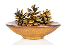 Group Of Three Whole Beautiful Pine Cone In Ceramic Bowl Isolated On White Background