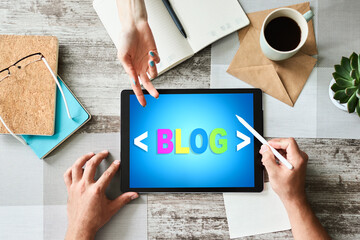 Wall Mural - tablet with blog text the on screen. social network, communication and internet marketing concept.