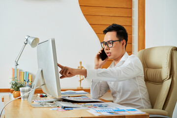Wall Mural - professional ui designer talking on phone with client discussing color change and font size with cus