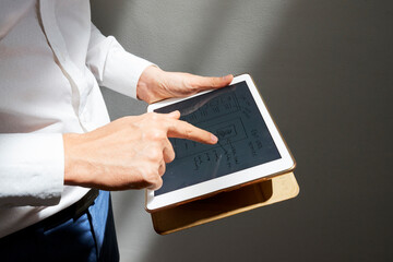 Wall Mural - close-up image of graphic designer drawing layout of mobile application or website on digital tablet