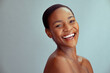 Cheerful mature black woman with healthy skin laughing with joy