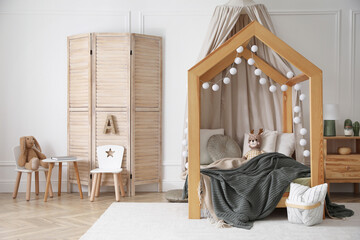 Poster - Stylish child room interior with wooden house bed