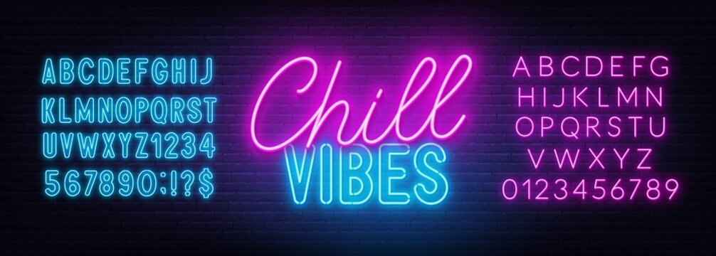 Chill Vibes neon lettering on brick wall background.