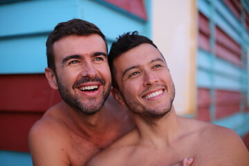 Wall Mural - Beautiful gay couple at the beach