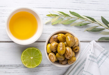 Wall Mural - Grilled green olives. Tasty organic green olives in the plate.