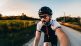 Closeup shot of a bicycle rider on the road making a selfie during the riding