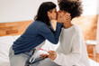 © (JLco) Julia Amaral - Couple celebrating a positive pregnancy test at home