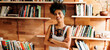 © (JLco) Julia Amaral - Young academic woman smiling in the library