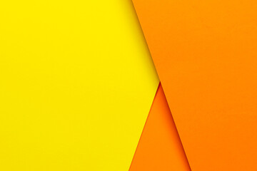 Wall Mural - abstract background concept with geometric shapes of three layers of orange paper and yellow paper background