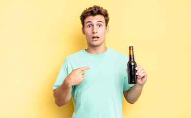 Wall Mural - looking shocked and surprised with mouth wide open, pointing to self. beer bottle concept