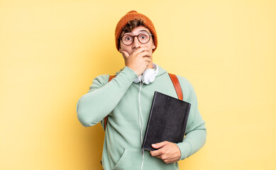 Wall Mural - covering mouth with hands with a shocked, surprised expression, keeping a secret or saying oops. student concept