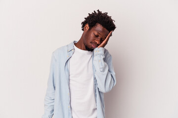 Wall Mural - Young african american man isolated on white background  who is bored, fatigued and need a relax day.