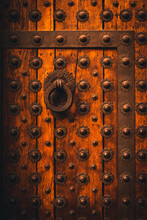 Old Wooden Door With Metal Studs And A Door Knocker