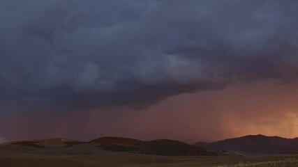 Wall Mural - Lightning bolts flashing through the sky at sunset panning over the horizon in Utah.