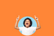 © khosrork - Wow, look up! Amazed boy pointing up to empty place on background, shocked, surprise with open mouth and showing copy space for advertisement. indoor, isolated in a round hole on orange background