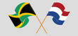 Crossed and waving flags of Jamaica and the Netherlands