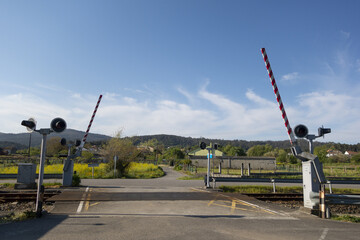 Wall Mural - Level crossing with a barrier on a railroad track in Valga, Galicia, Spain